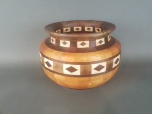 Example of segmented woodturning with two feature rings with diamonds. 