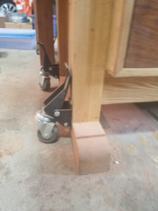 One of the best tips to organizing a small woodshop is to attach casters to heavy tools like this workbench.