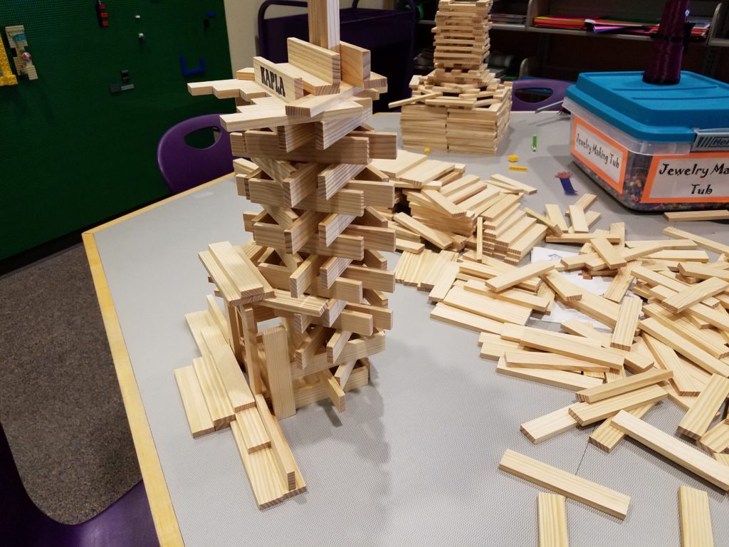 A tower built with the scrap wood sticks.