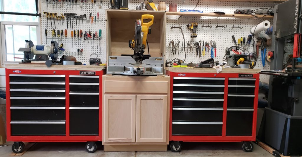 miter saw station with dust hood to collect wood dust.